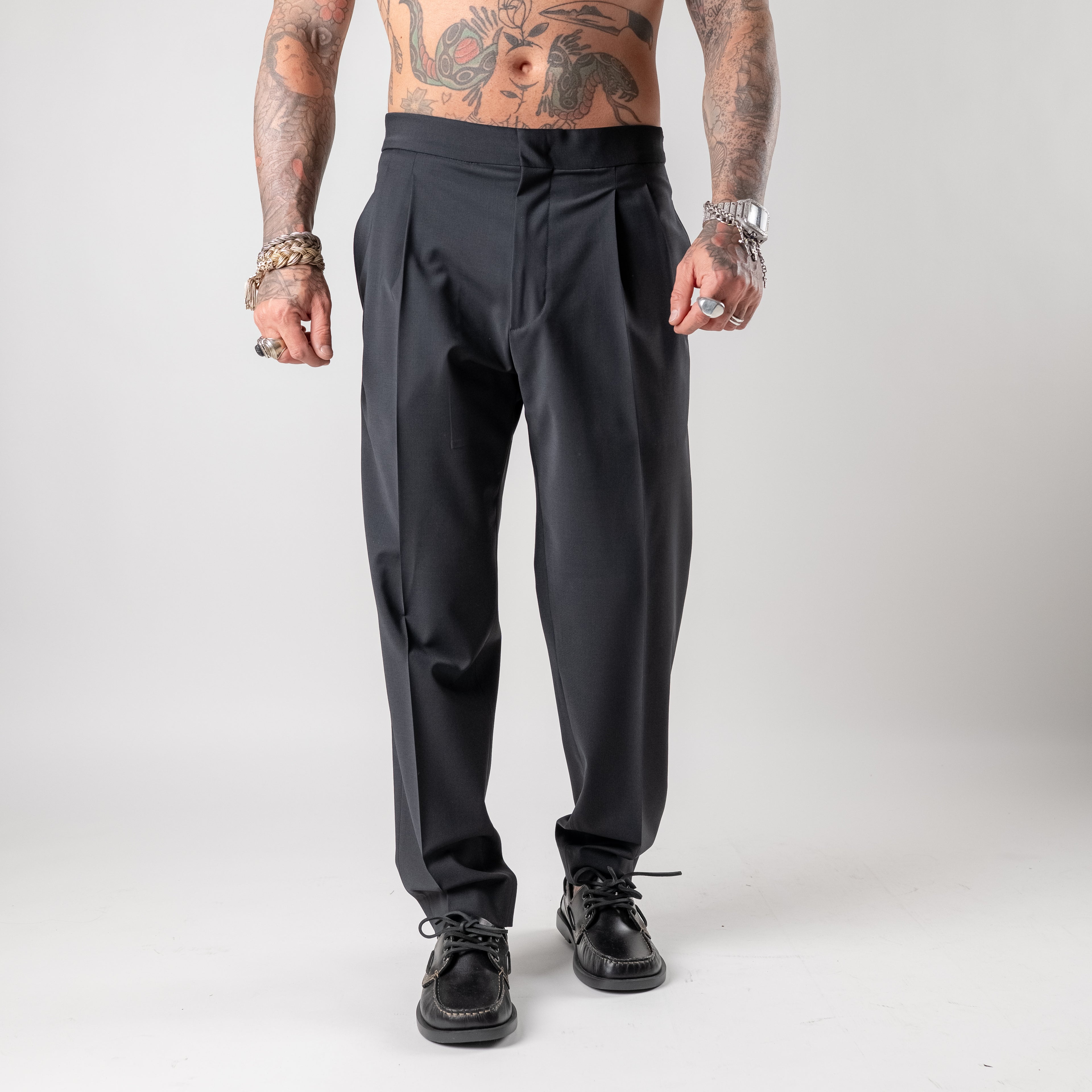 Double-pleated wool blend trousers with side buckle