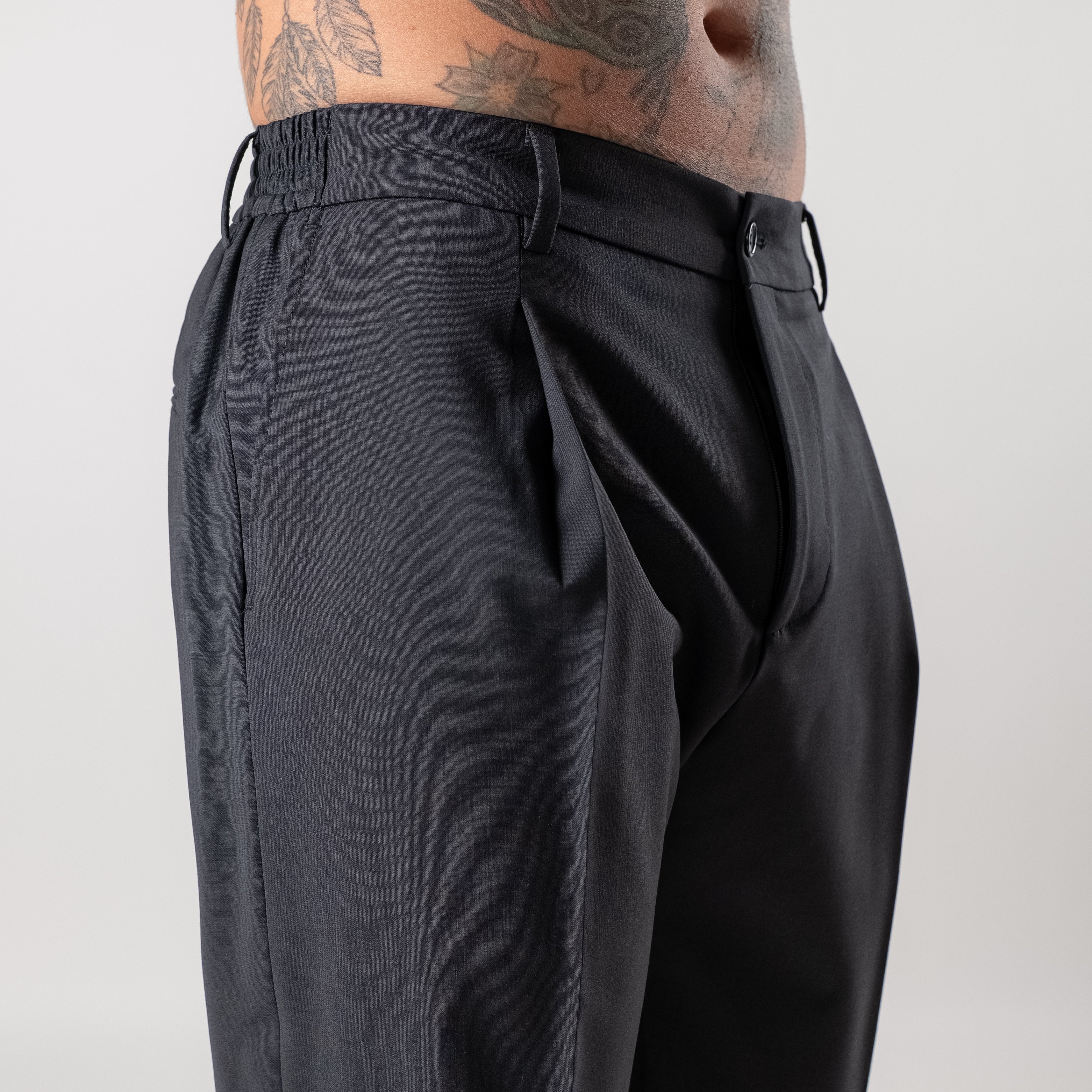 Regular trousers with half elasticated waist