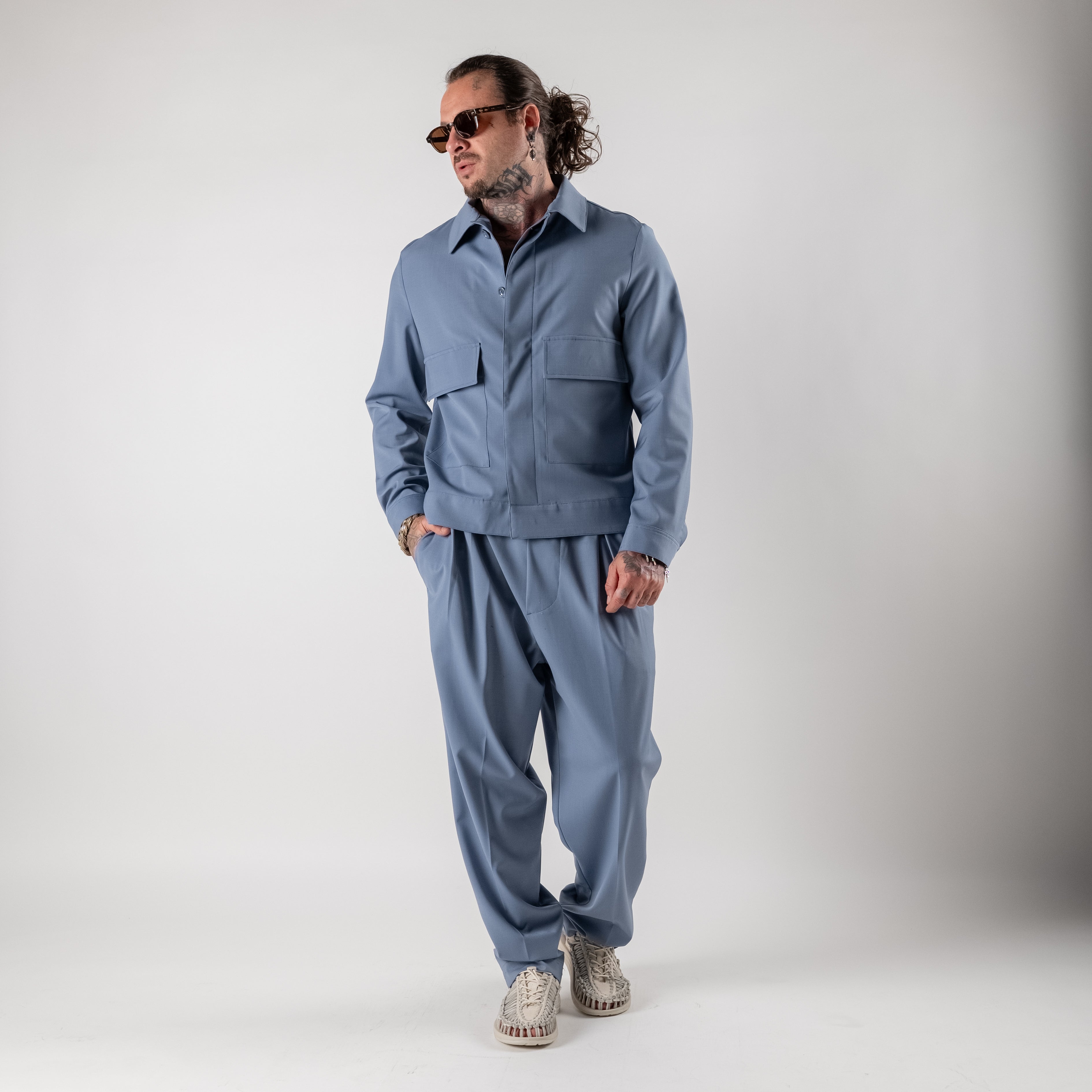 Pleated trousers with elasticated waist