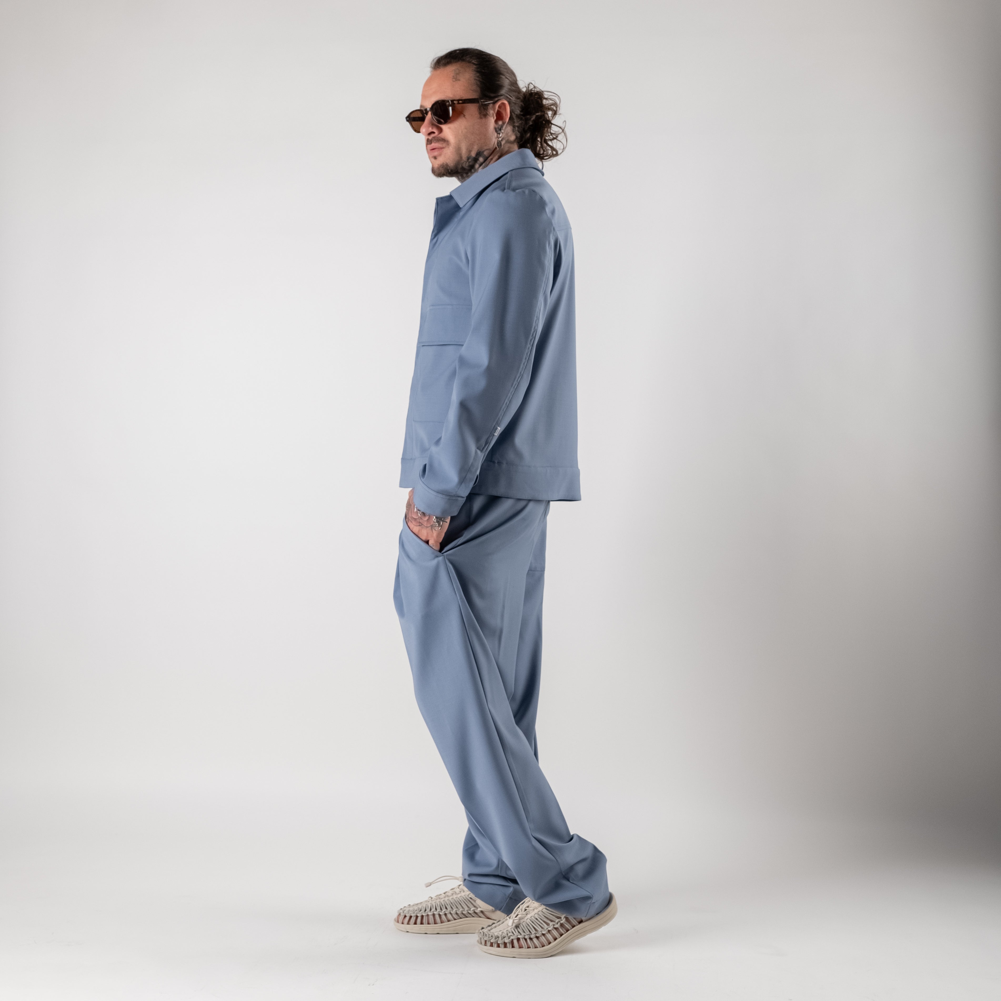 Pleated trousers with elasticated waist