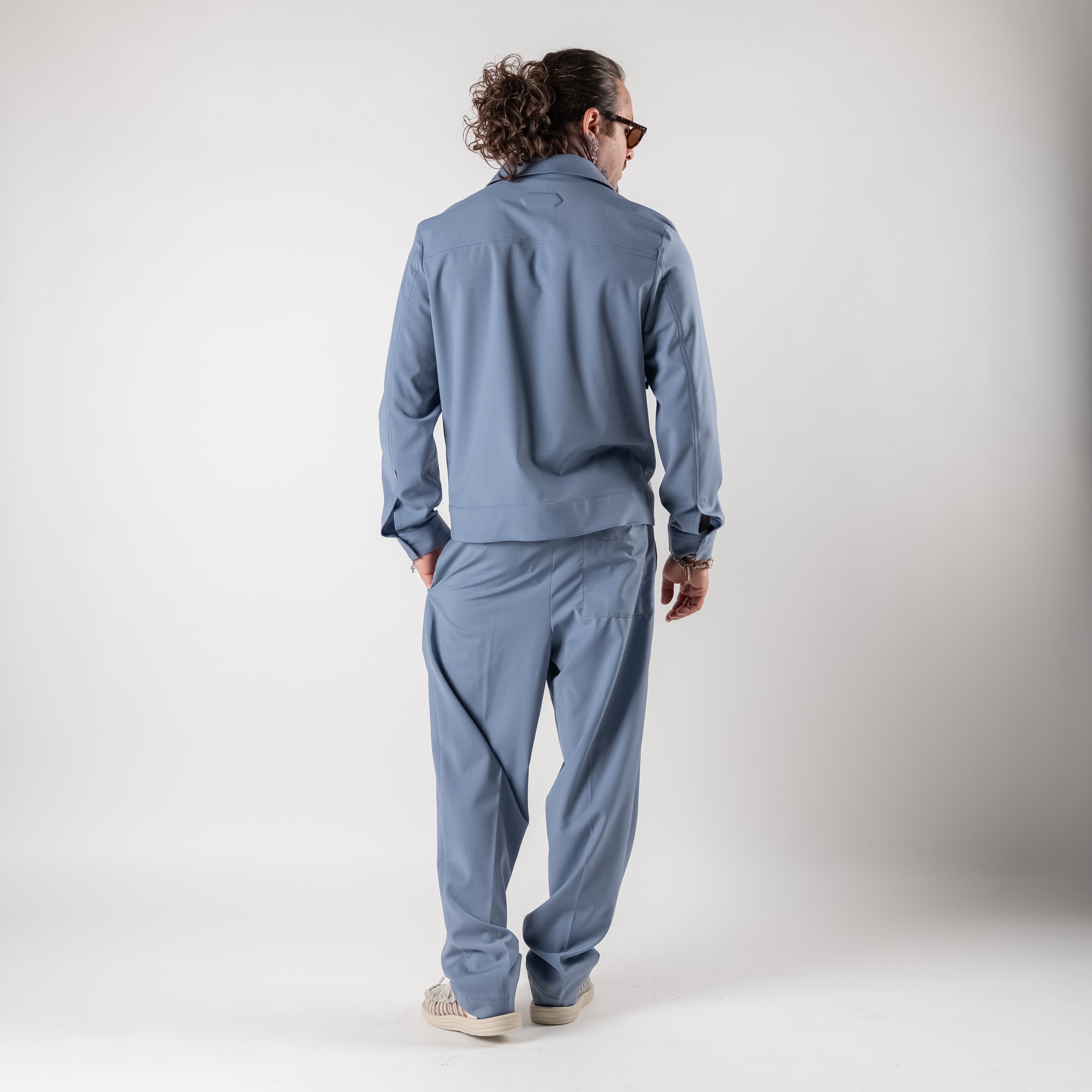 Pleated trousers with elasticated waist