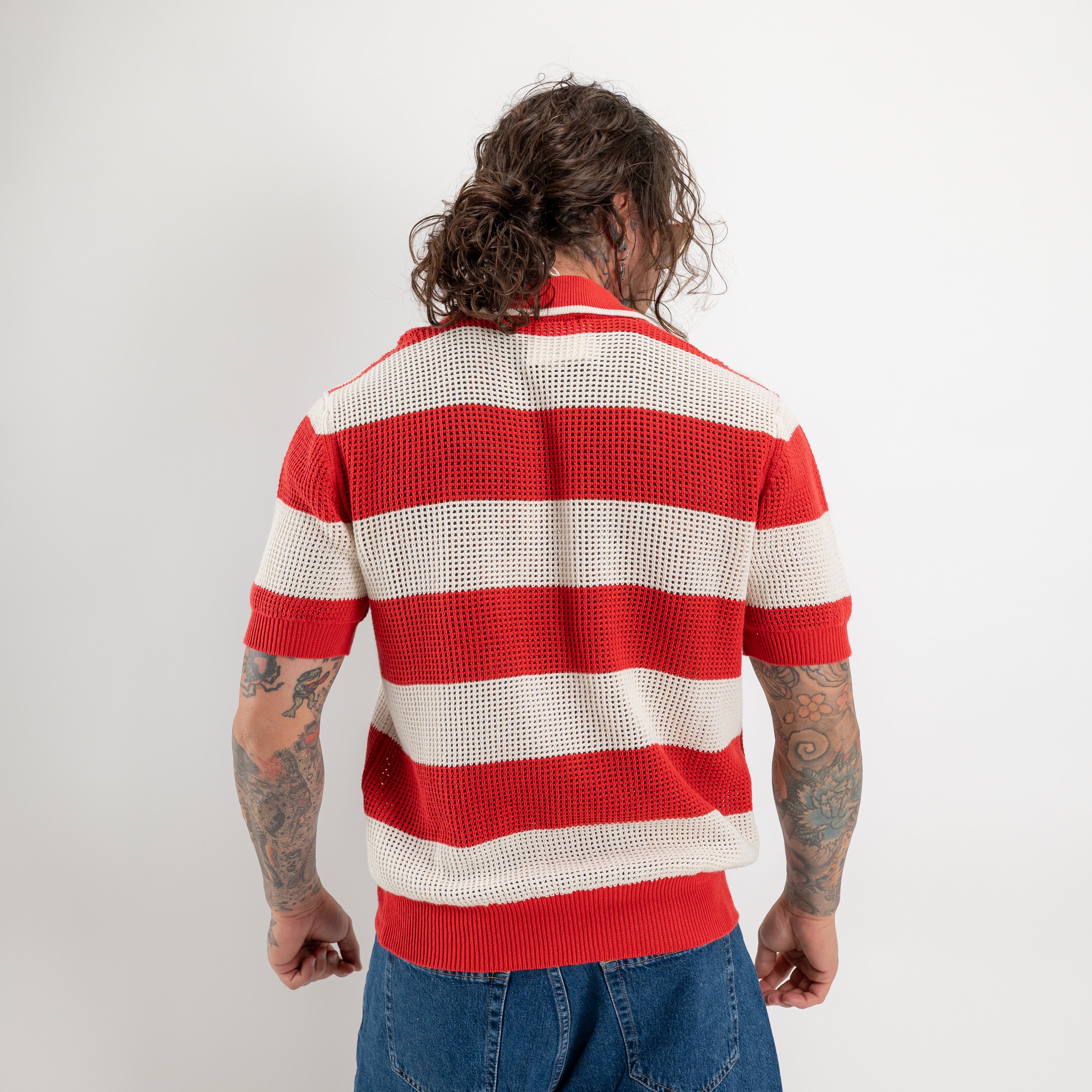 Polo in maglia traforata rigato